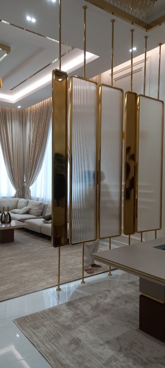 Fluted-glass & gold divider by Pillarstone in the UAE