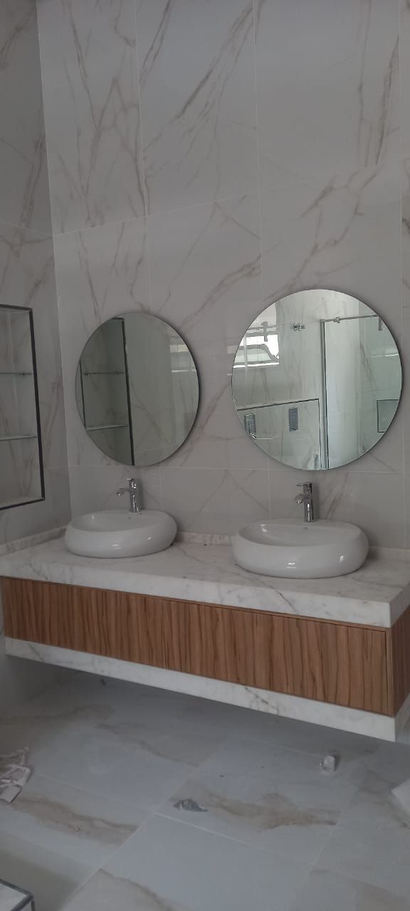 Vanity with round mirrors by Pillarstone in the UAE