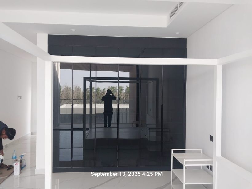 Glass-door wardrobe by Pillarstone in the UAE