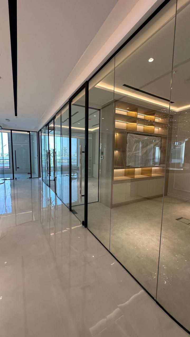 Framed glass partitions by Pillarstone in the UAE
