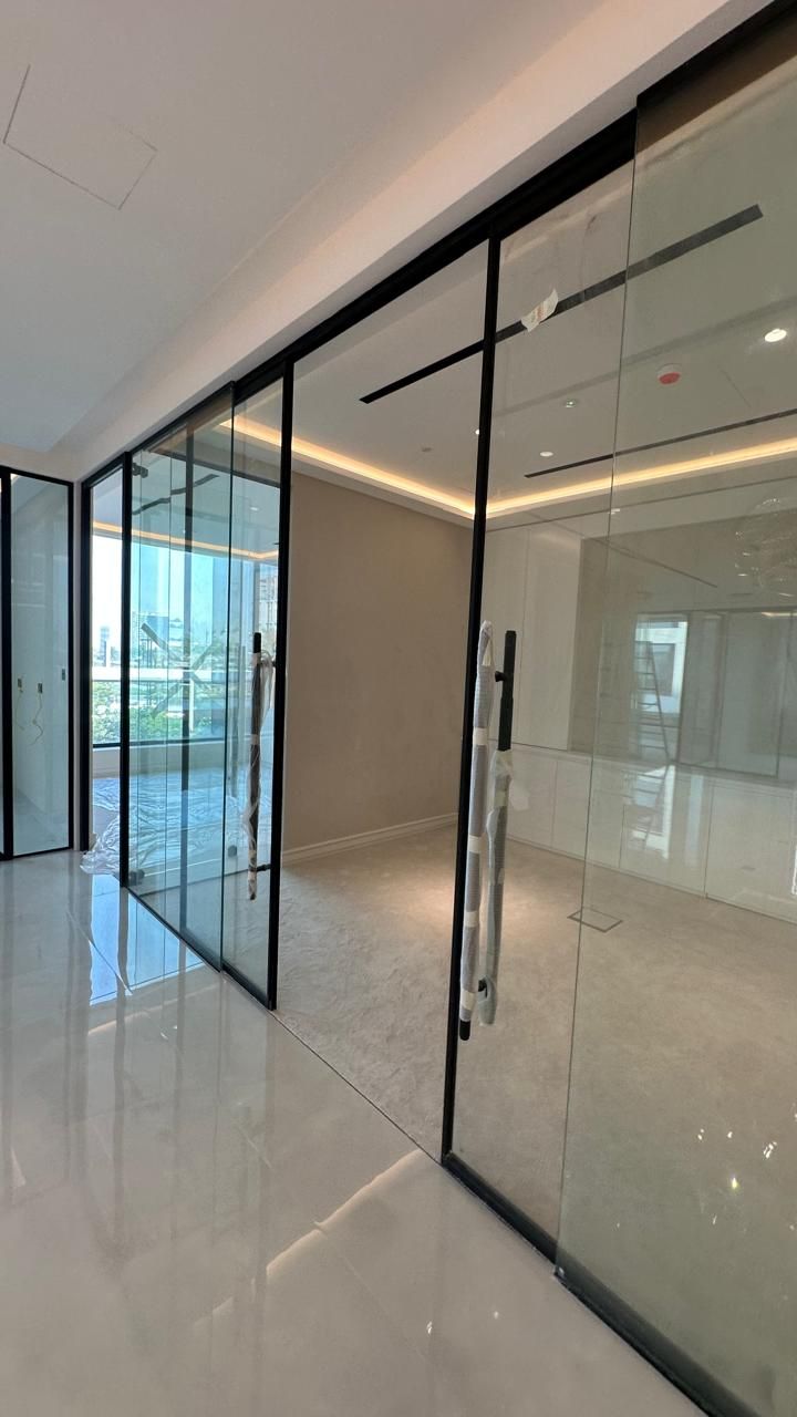 Glass sliding partitions by Pillarstone in the UAE